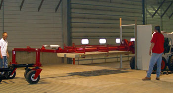 The Hog Slat Carrier swivels 90 degrees to allow hog slats to be easiy brought in through standard doors. 