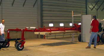 The Hog Slat Carrier swivels 90 degrees to allow hog slats to be easiy brought in through standard doors.