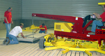 The Doeden Slat Replacer or DSR is shown here in the folded position. This unique design allows the machine to enter a building through a standard walk in door opening.